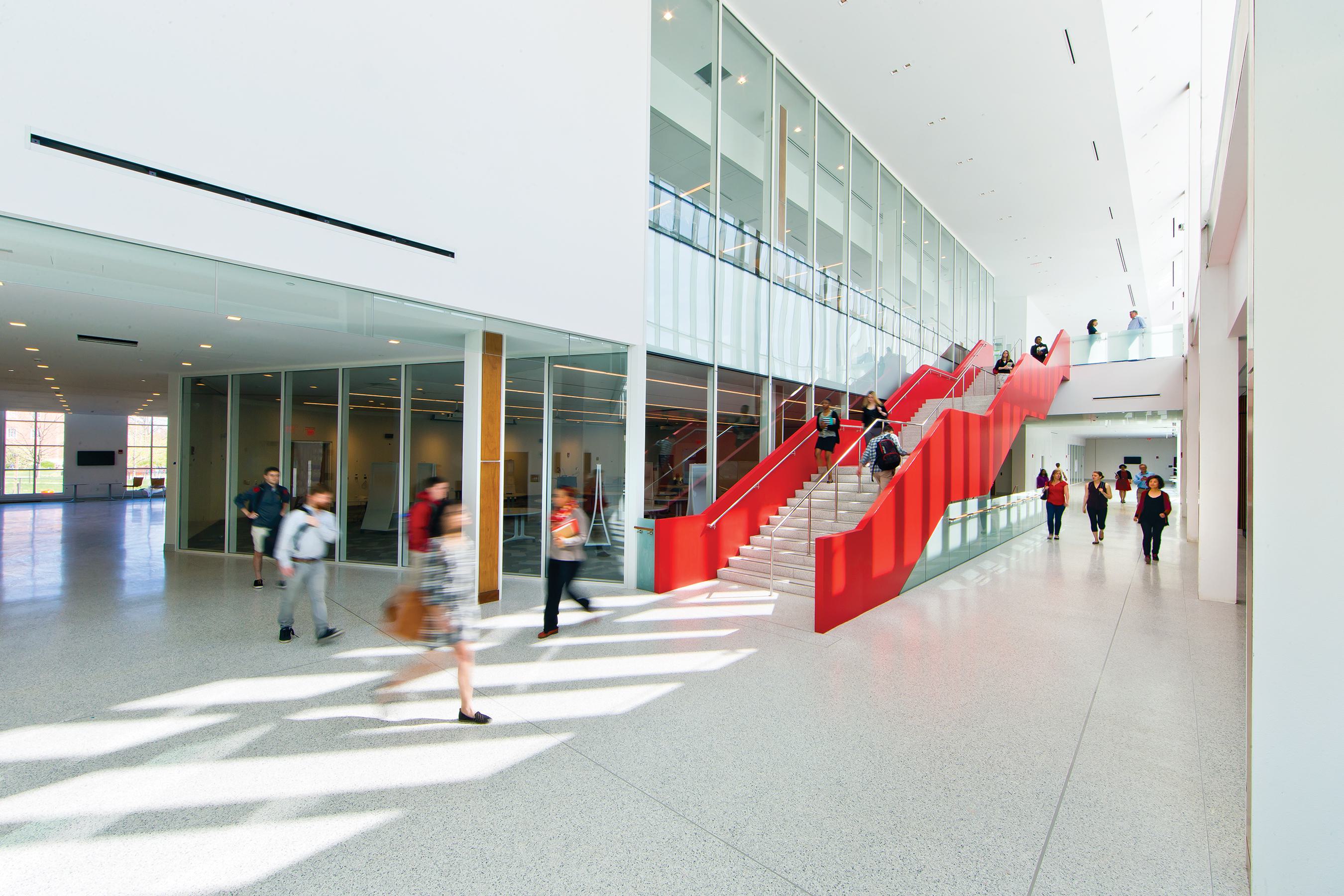 Students walking through the Edward St. John Learning Teaching Center.