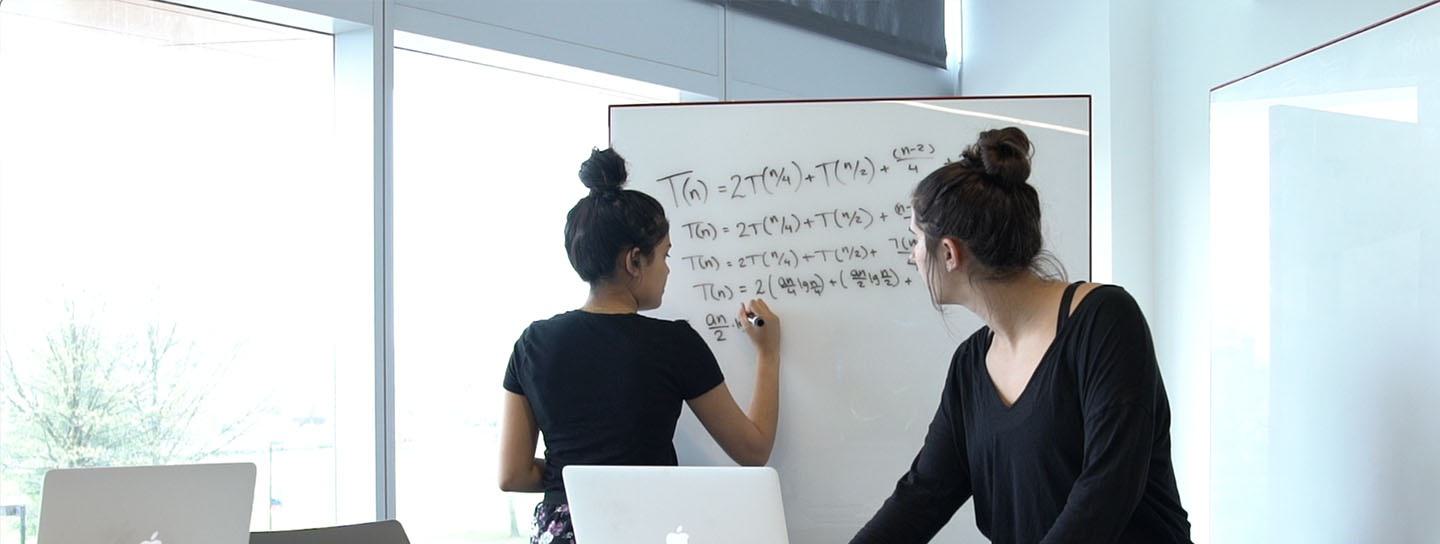 Students at a whiteboard