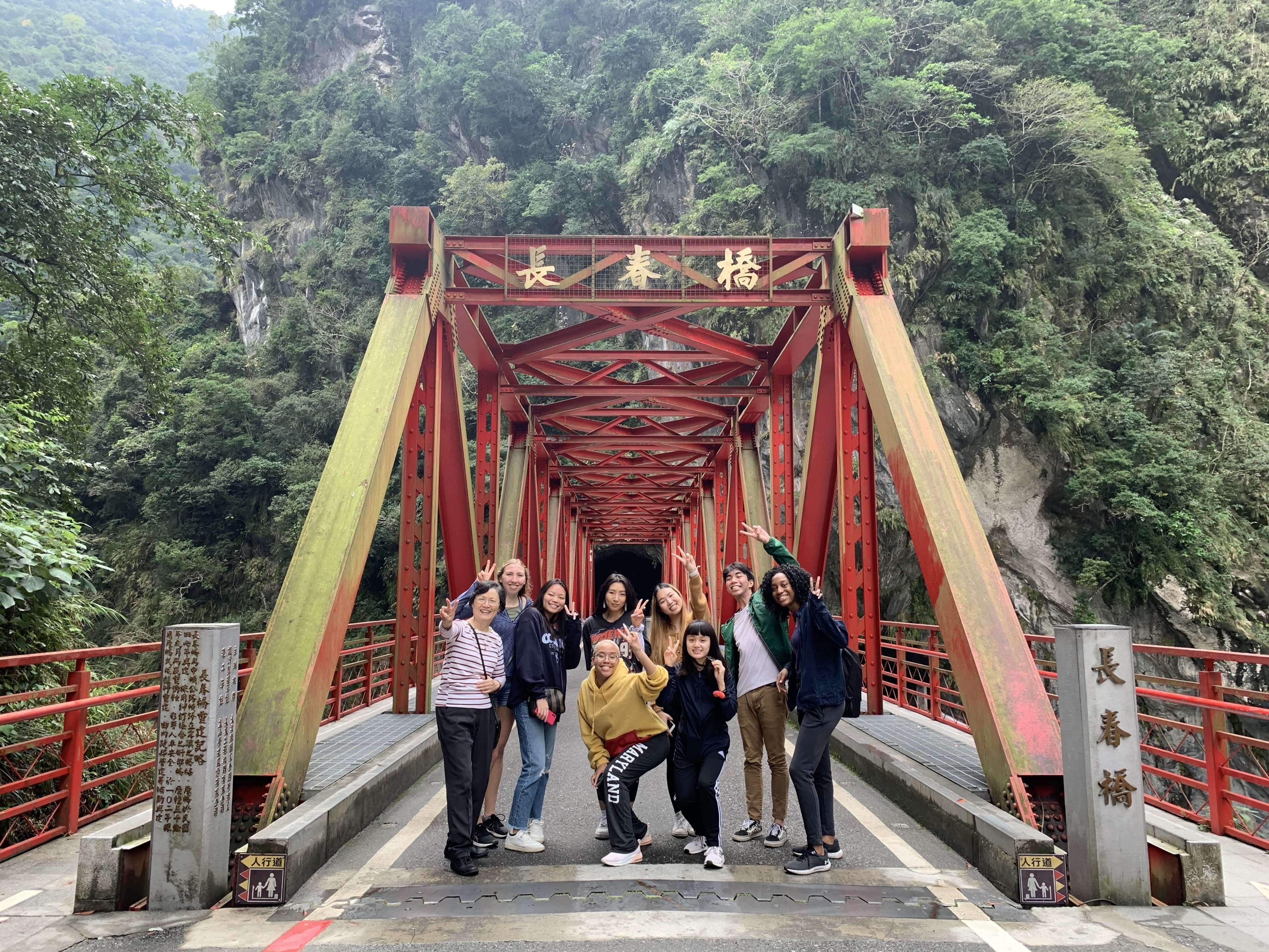 Group of UMD students standing on a bridge in Taiwan.