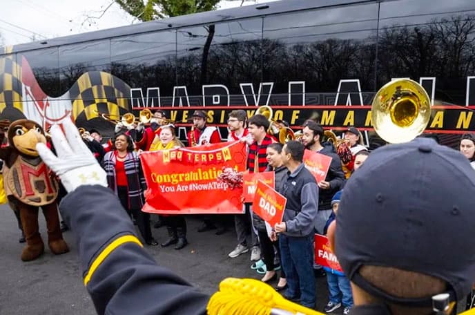 Marching band cheering for an admitted student